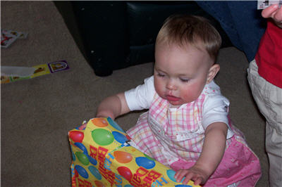 Abi opening her own gift
